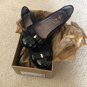 Black/gold Cole Haan flats